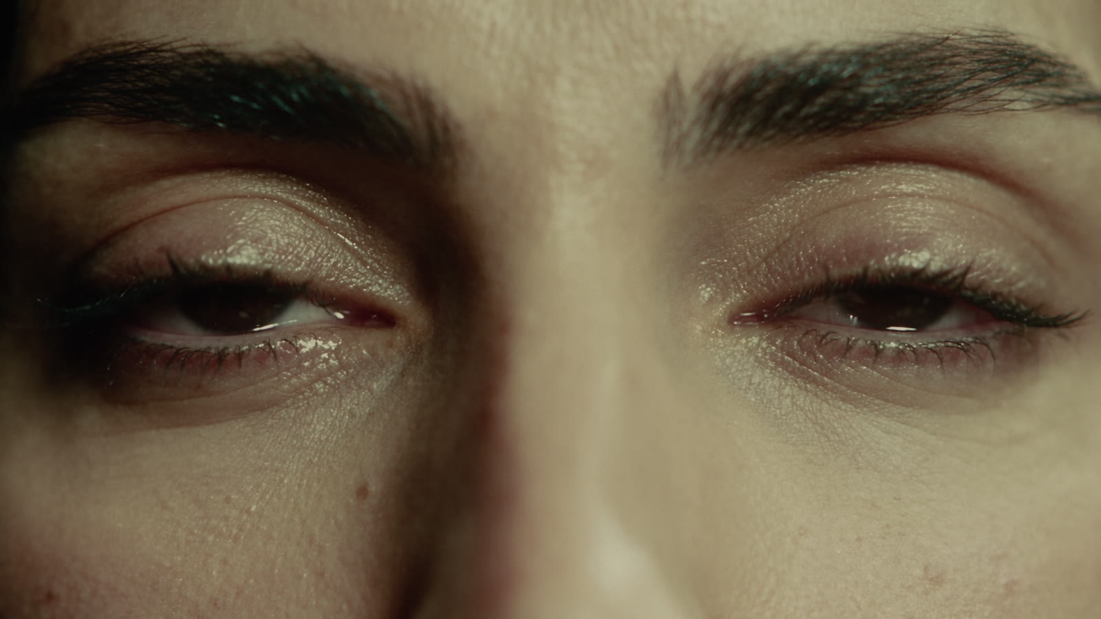 Macro of wet eyes under stage light