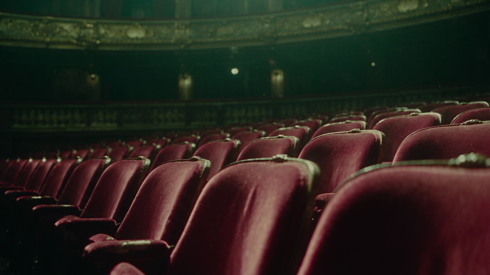 Rows of empty red velvet seats
