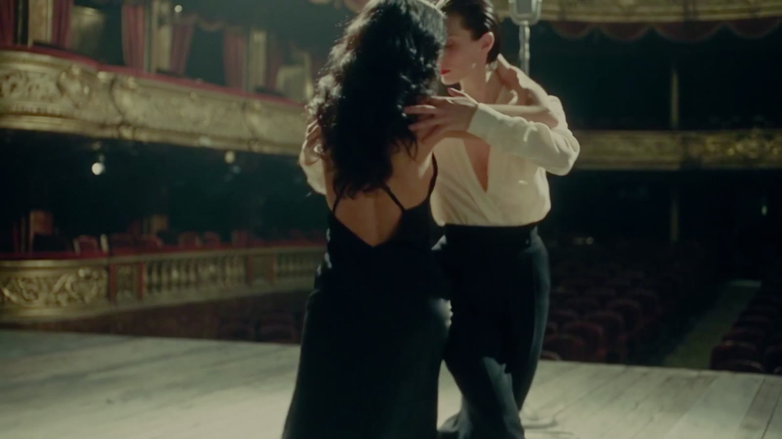 The two women dancing a tango on the empty stage