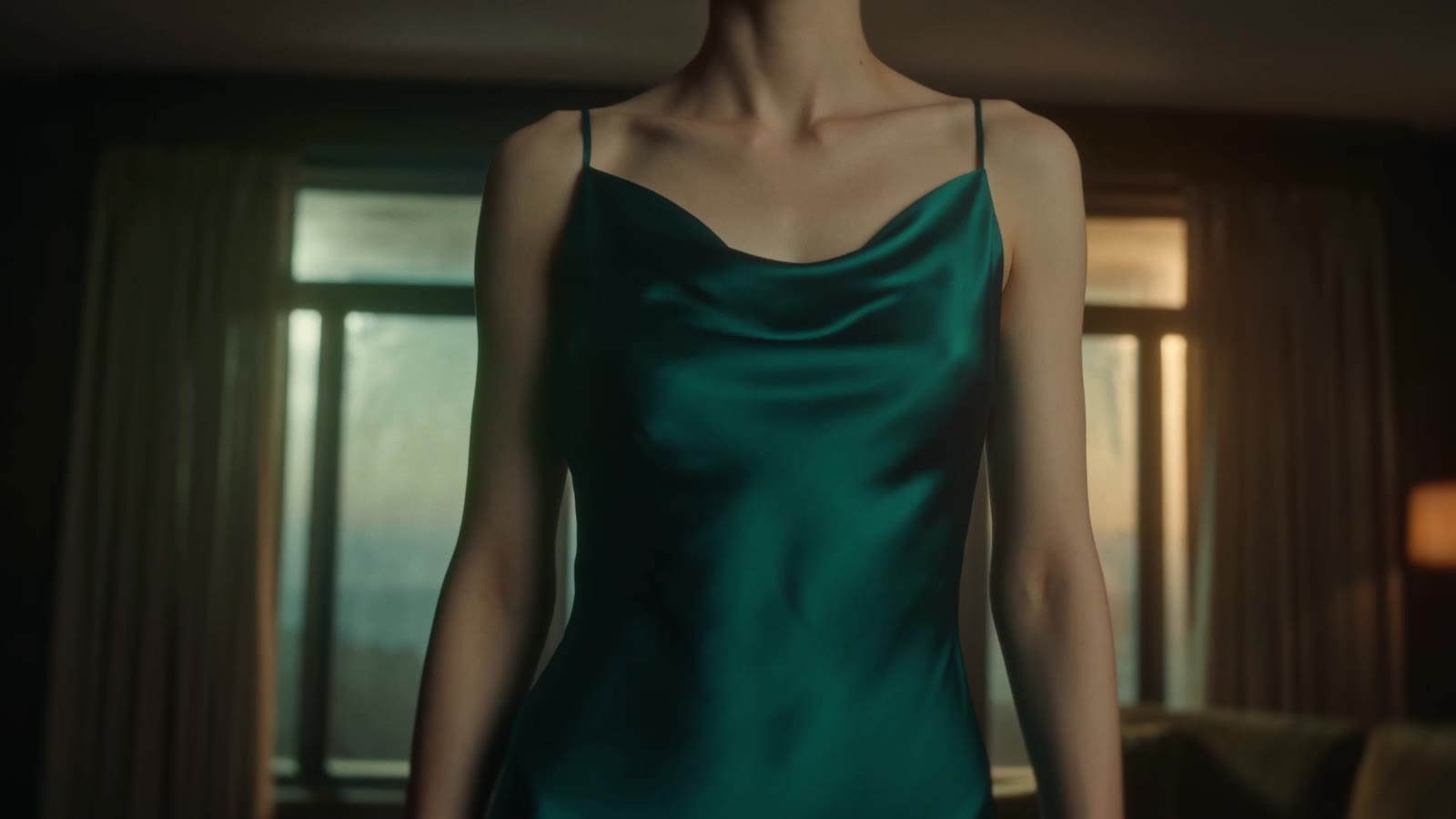 Detail of the green satin slip dress